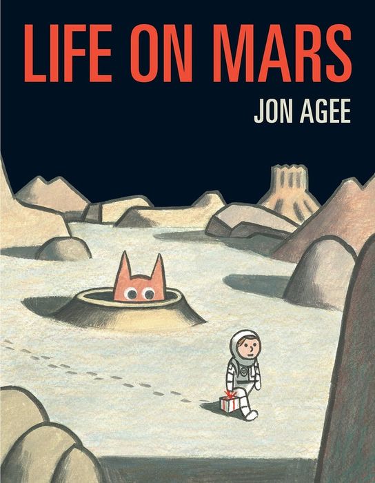The book cover showing an astronaut standing on Mars with a monster looming behind him.