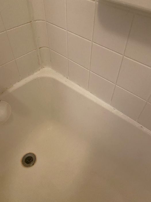 The same tub now sparkling clean and white after treatment