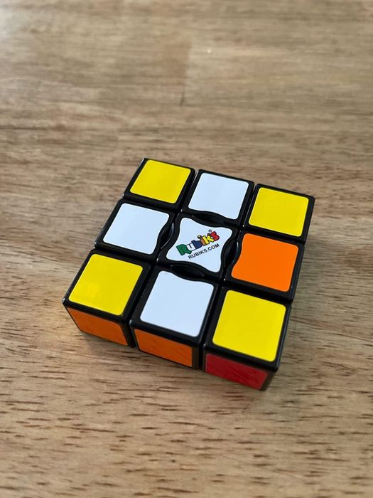 The toy placed on a table, showing one side clearly.