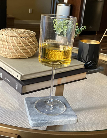 The glass filled with white wine.