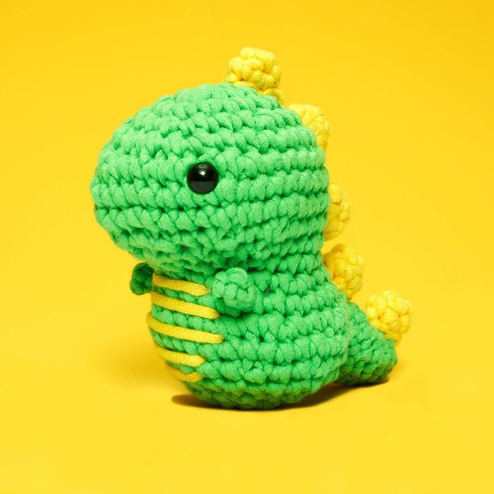 A crocheted dinosaur figure