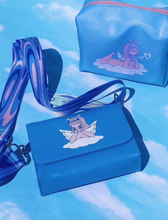 An image of a blue crossbody bag accompanied by a cosmetics pouch.