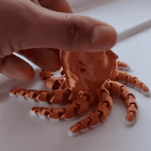 A brown Dwayne 'The Rock' Johnson/octopus fidget spinner.