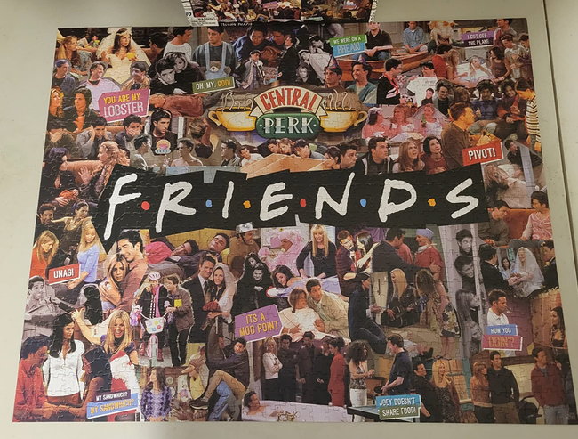 A reviewer's photo showcasing the completed Friends puzzle.