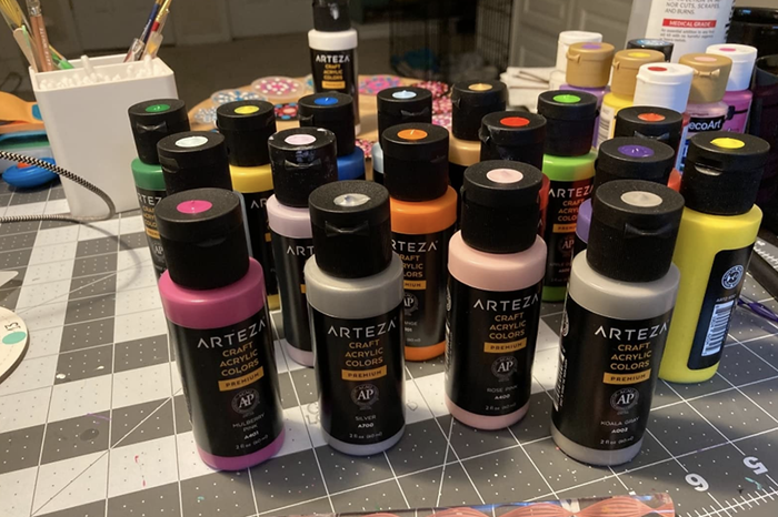 A reviewer photo of a variety of acrylic paints