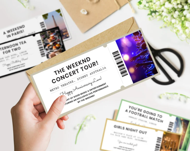 A person holding a DIY ticket for The Weeknd's concert tour