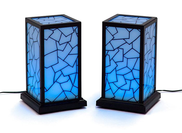 Two friendship lamps glowing blue.