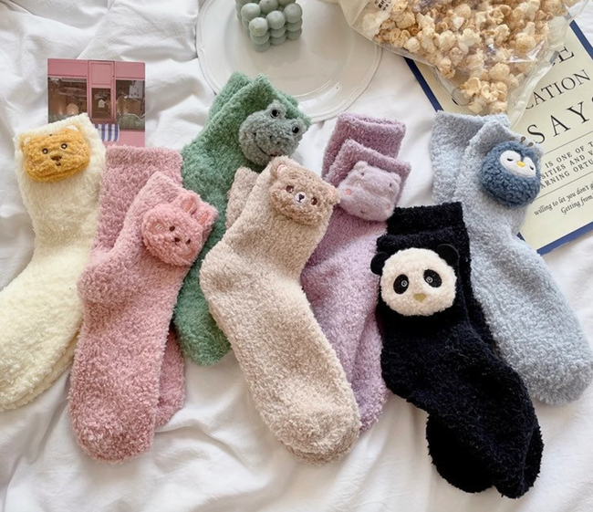 An assortment of animal-themed fuzzy socks