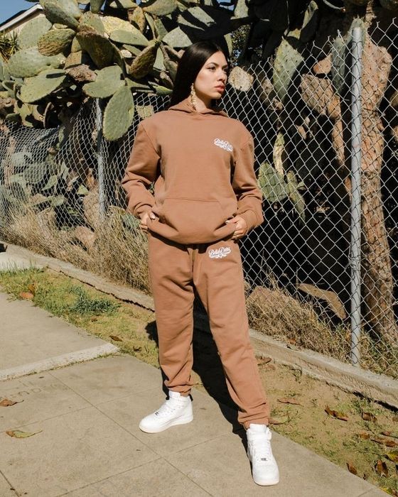 A model is seen wearing the classic sweats in brown.
