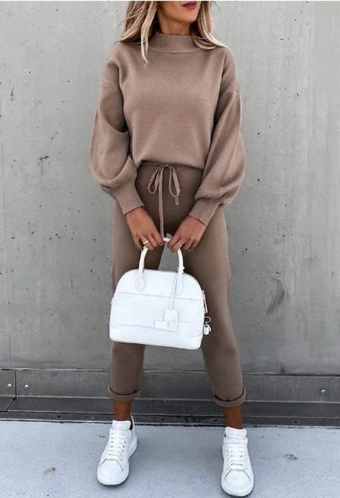 A model wearing the jogger set in a rich coffee hue.