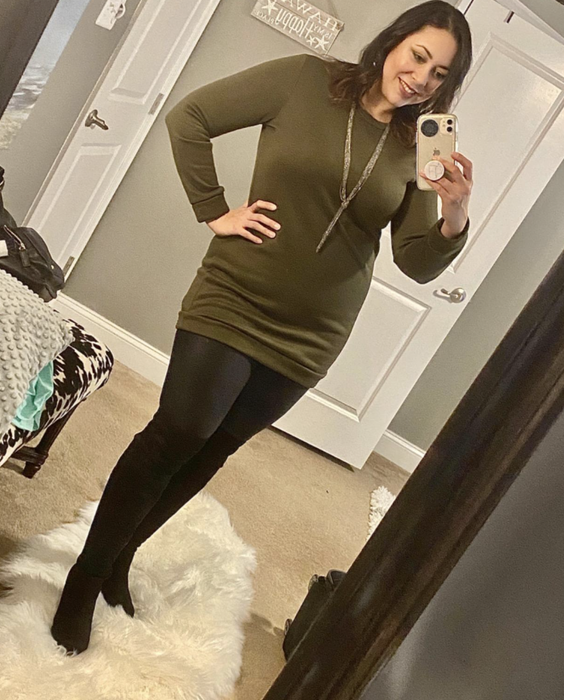 A customer review showing a mirror selfie of the dress in green.