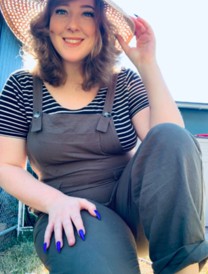 A customer-uploaded photo of them relaxing while sitting in the overalls