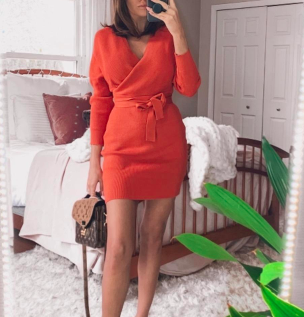 A customer review photo showing them wearing the dress in orange.
