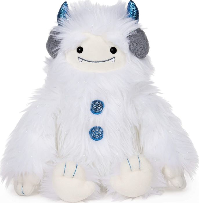 A soft, white plush yeti doll featuring blue horns and button eyes