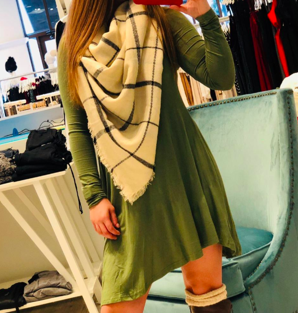 A customer review photo featuring the dress in green.