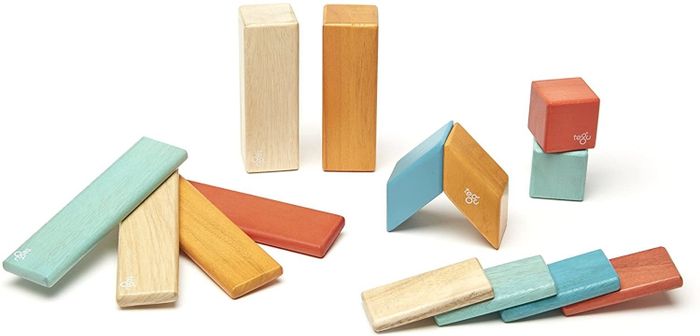 A collection of magnetic blocks in soft, muted colors arranged randomly