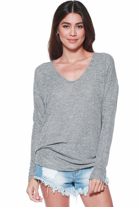 A model is dressed in the sweater in a chic gray shade.