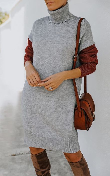 A model showcasing the dress in gray with brown sleeves.