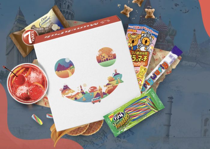 A MunchPak subscription box full of diverse snacks, candies, and other tasty delights.