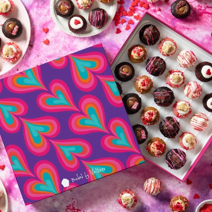 The Valentine's Day-themed box filled with an assortment of cupcakes