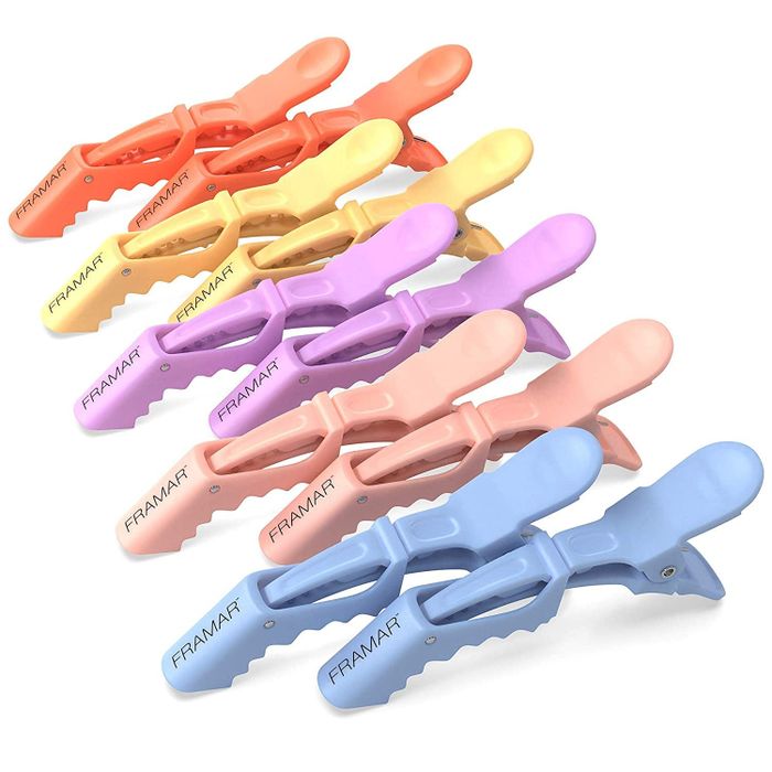 A stack of eight Framar hair clips, available in both pastel and bold colors, perfect for styling