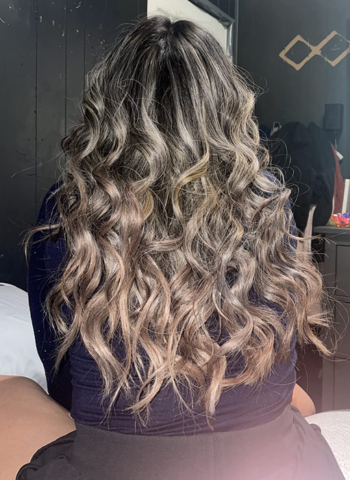 Another reviewer flaunting her curls that cascade down her back.
