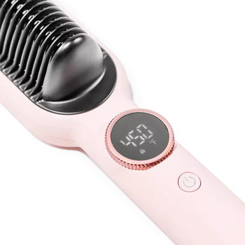 A hair straightening brush showing the temperature on the digital screen, indicating that it is powered on