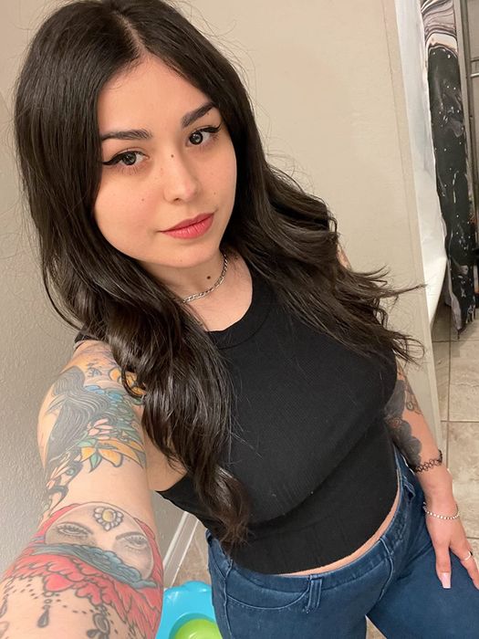 A person proudly displaying their beautifully curled hair.