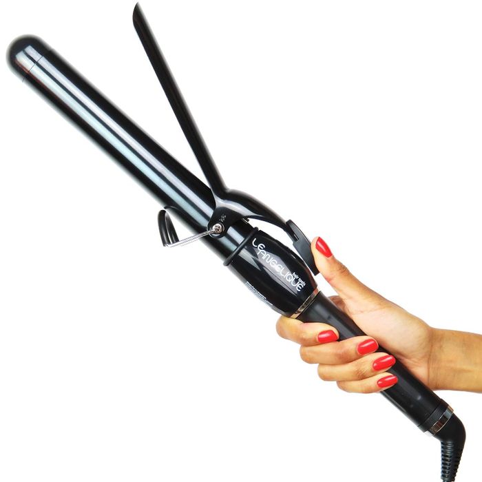 A hand grips the Le Angelique hair straightener, an ideal choice for a shopping article focused on hair styling tools.