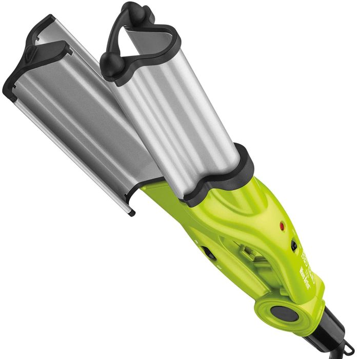 A handheld garment steamer with a metal faceplate and green accents