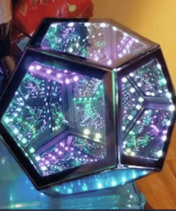 A lamp with shifting, color-changing lights that move within the structure