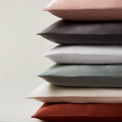 A pillowcase available in a range of colors including pink, black, grey, blue, cream, and red, offering both comfort and style for any bedroom.