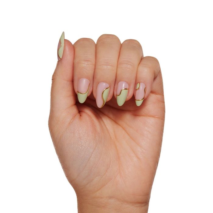 A hand featuring nail art with lines and soft green accents on the nails.