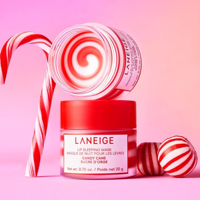 Jar of Laneige Candy Cane Lip Sleeping Mask, displayed with candy canes, featured in a shopping guide