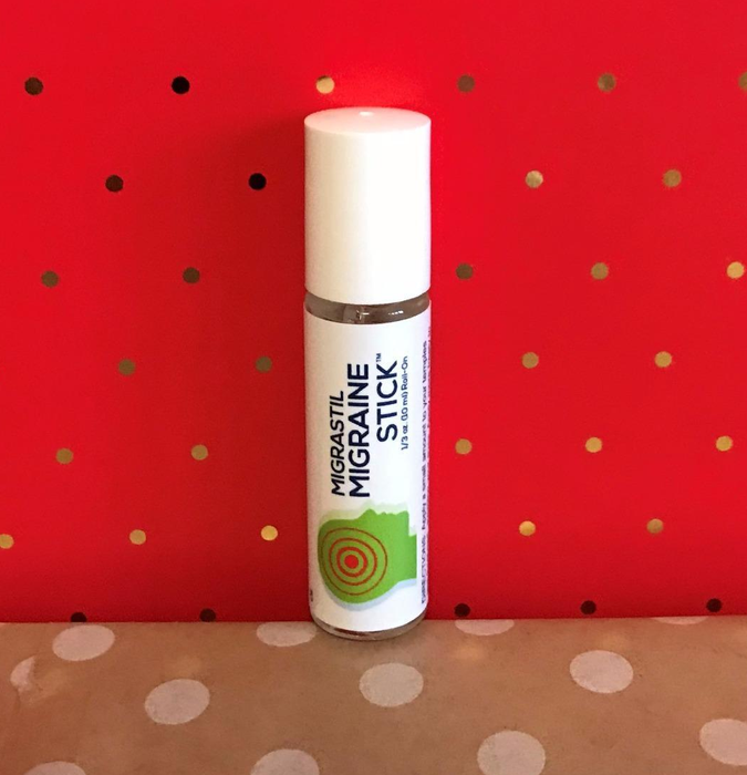 The migraine stick set against a bold red background.