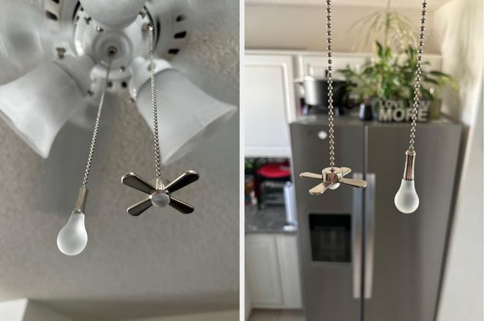 Ceiling fan and light pull chains: one with a bulb-shaped end and the other with a fan-shaped end, both hanging in a kitchen space.