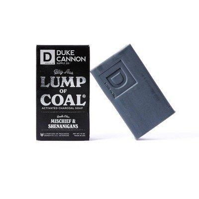 A sleek black package containing grey soap, perfect for adding a touch of humor and luxury to any bath or shower.
