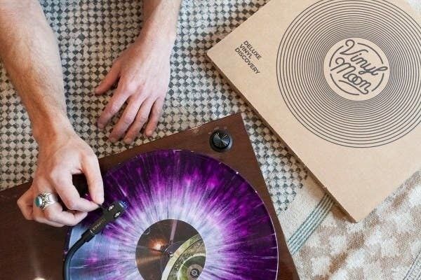 A person enjoying the smooth sounds of a vinyl record