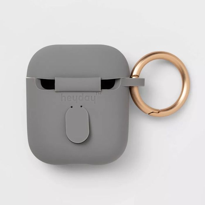 A grey AirPods case featuring a gold clip