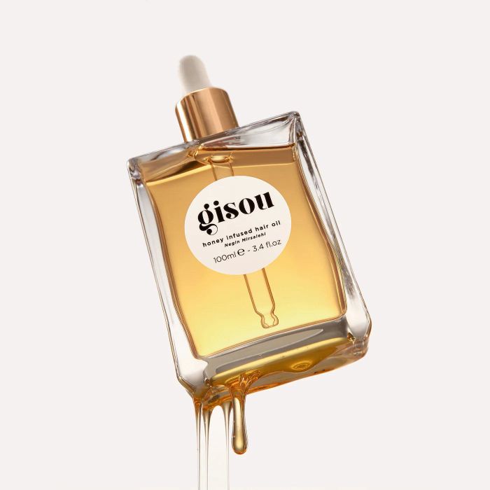 A bottle of Gisou honey hair oil