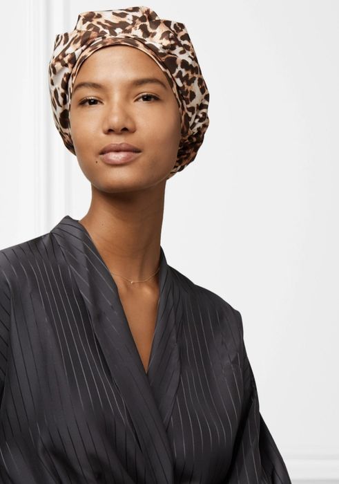 A model sporting a leopard-print shower cap.