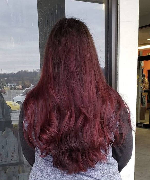 A person showcasing hair with impressive volume and texture.
