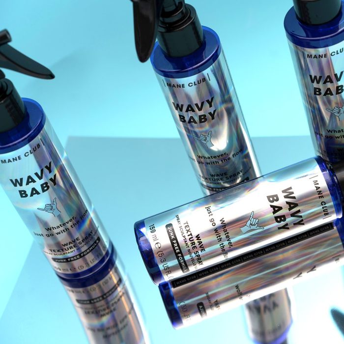 a lifestyle image featuring four spray bottles