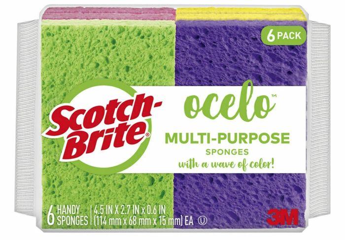 A six-pack of Scotch-Brite Ocelo multi-purpose sponges featuring vibrant green, pink, and purple designs, labeled 
