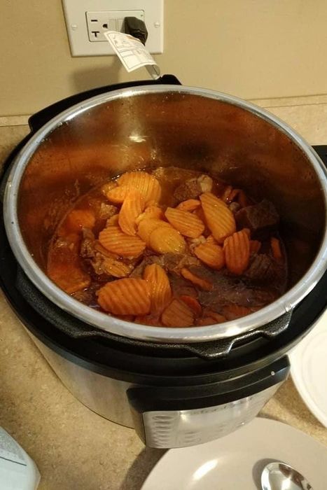 a reviewer’s photo of the Instant Pot opened to reveal homemade soup inside
