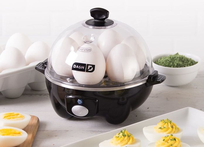 the black egg cooker filled with six eggs