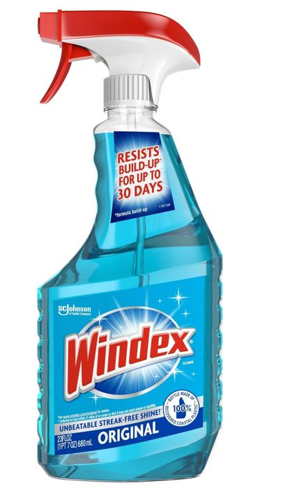 A bottle of Windex Original glass cleaner featuring a red spray nozzle, designed to deliver a streak-free shine and prevent buildup for up to 30 days