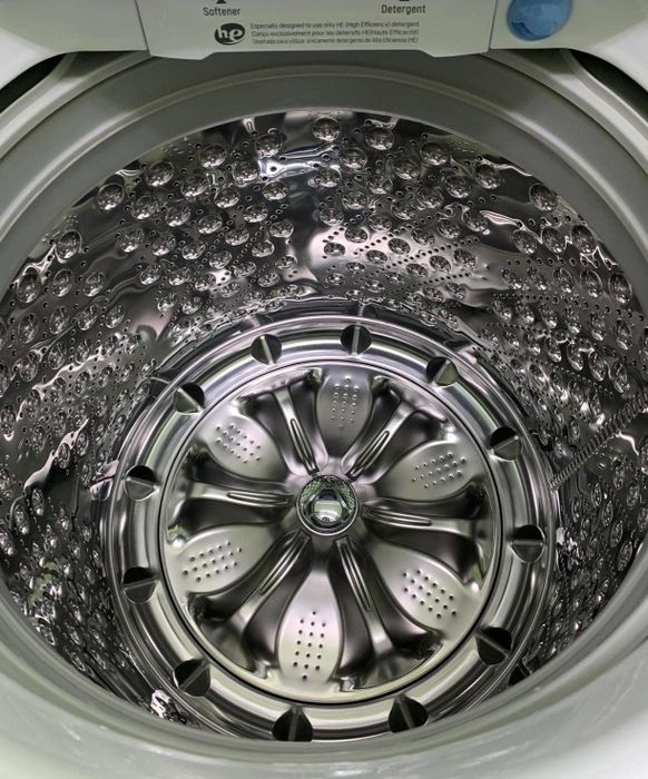 A reviewer's photo showing the gleaming interior of their washing machine