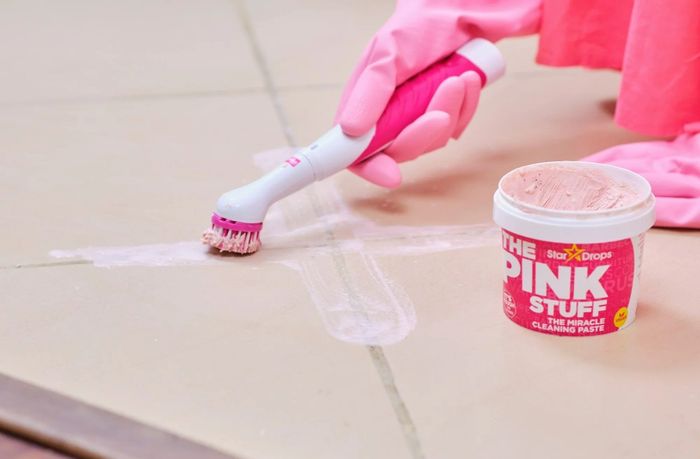 A cleaning paste paired with a brush effectively removes dirt from tile flooring