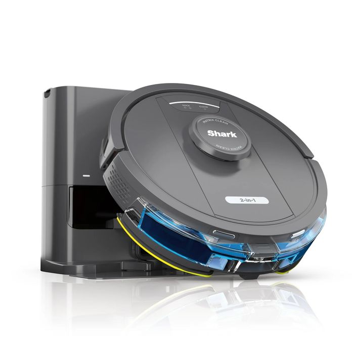 A robot vacuum accompanied by a charging dock, showcasing a modern design, perfect for efficient home cleaning solutions